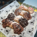 Dolce Bella branded paper with cannoli on a background